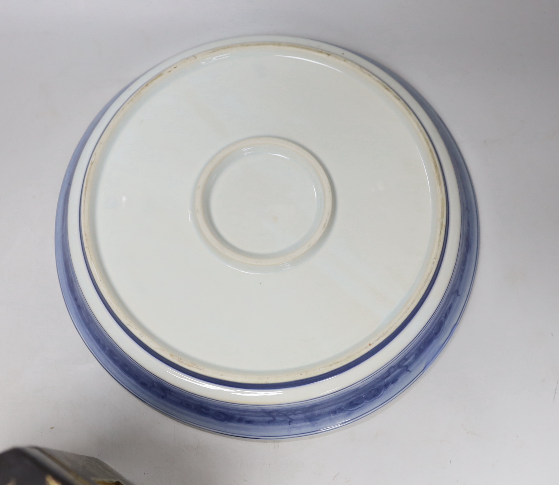 A Chinese blue and white dish, a famille rose bowl, a Canton enamel box and cover and a gilt decorated lacquer box and cover